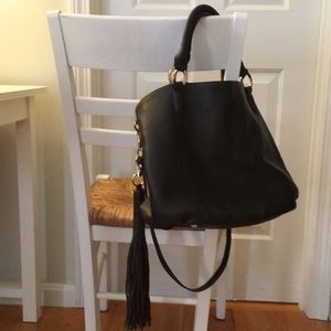 Brown leather. Detachable tassel, strap